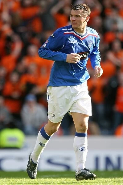 Lee McCulloch Lifts the CIS Insurance Cup: Rangers FC's Triumph over Dundee United (2008)