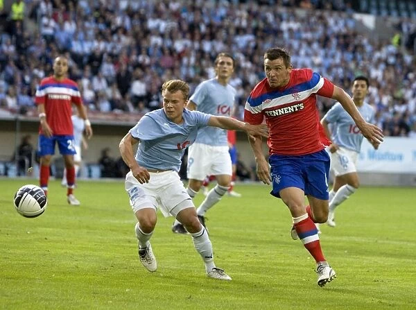 Lee McCulloch vs Filip Stenstrom: A Battle of Midfielders in the 1-1 Stalemate between Malmo FF and Rangers (UEFA Champions League Third Qualifying Round)