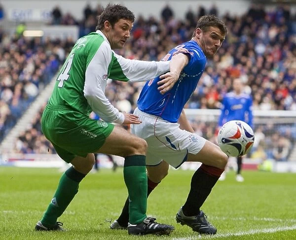 Lee McCulloch vs Martin Canning: Intense Clash in Rangers vs Hibernian's Clydesdale Bank Premier League Match at Ibrox (2-1 in Favor of Rangers)