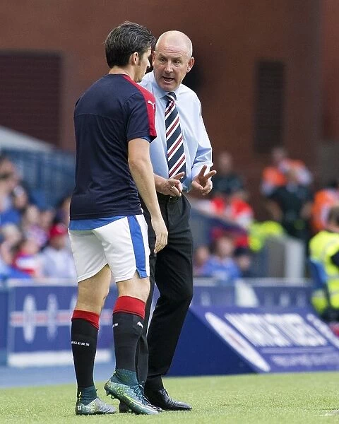 Mark Warburton and Joey Barton: Deep in Pre-Match Discussion at Ibrox Stadium - Rangers FC