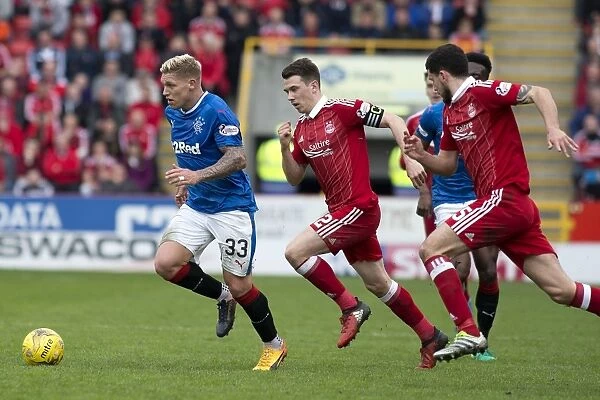 Martyn Waghorn Charges Forward in Intense Rangers vs. Aberdeen Clash at Pittodrie Stadium