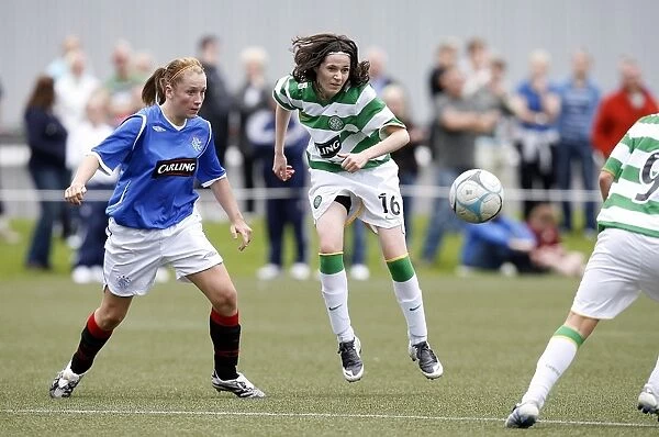 A Moment of Clarity: Heather McGaw Clears the Ball Against Cheryl Gallacher in the Celtic vs Rangers Ladies Match (2008)