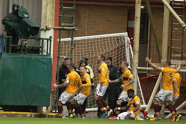 Motherwell's Peter Hartley Scores and Celebrates with Team Mates Against Rangers in the Ladbrokes Premiership at Fir Park