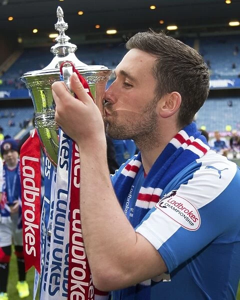 Nicky Clark's Triumphant Moment with the Ladbrokes Championship Trophy at Ibrox Stadium