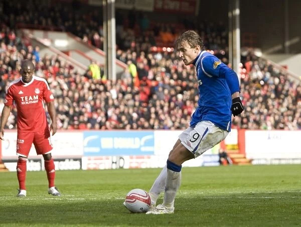 Nikica Jelavic Scores the Decisive Penalty: Rangers Victory at Pittodrie Stadium (1-2)