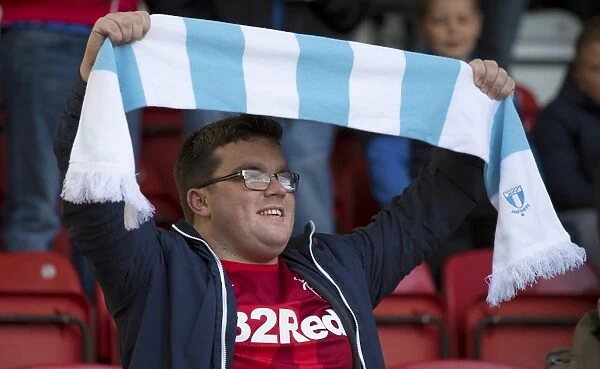 Passionate Rangers Fan Waves Malmo Scarf at Airdrieonians League Cup Match