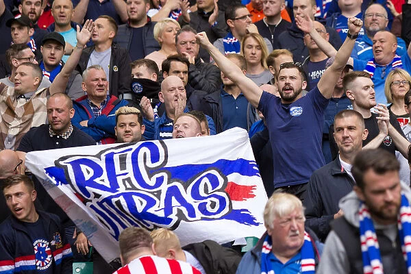 Passionate Rangers Fans Unite in Blue and White: A Sea of Supporters at Celtic Park during the Ladbrokes Premiership Match