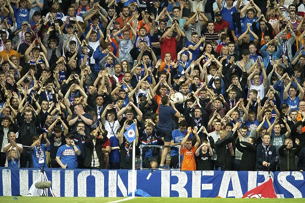 Passionate Rangers Fans Unite: A Sea of Pride and Tradition at Ibrox Stadium During the Europa League Qualifier vs FC Shkupi
