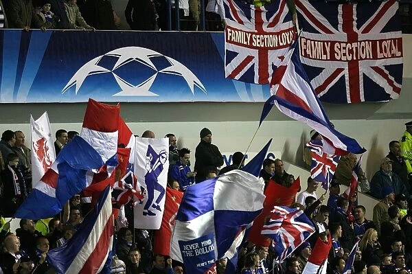 Passionate Rangers FC Fans Waving Flags at Ibrox Stadium during UEFA Champions League Match vs. Olympique Lyonnais (3-0)