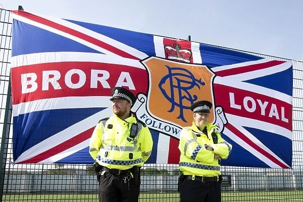 Police Protect Brora Rangers Flag During Pre-Season Clash: Rangers Win 2-0