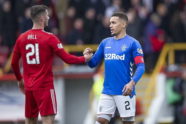 Rangers and Aberdeen - Scottish Cup Quarter-Final: Tavernier and Ball Share a Moment at Pittodrie Stadium