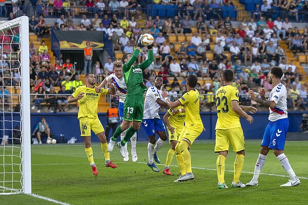 Rangers in Action: Lassana Coulibaly and Joe Worrall Battle for the Ball in UEFA Europa League against Villarreal (Group G, Estadio de la Ceramica)