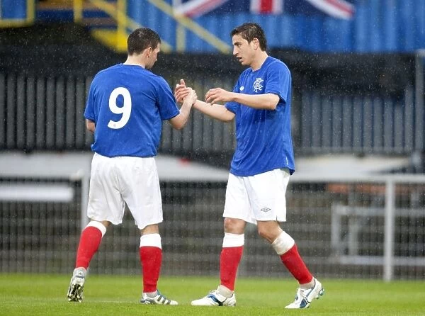 Rangers Bedoya and Healy: Unstoppable Duo Celebrates 2-0 Goal Against Linfield at Windsor Park