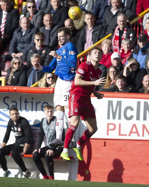 Rangers Borna Barisic Leaps for the Ball in Scottish Cup Quarter-Final at Pittodrie Stadium