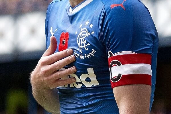 Rangers Captain Lee Wallace Honors Fallen Heroes with Poppy Tribute during Rangers vs Kilmarnock Match