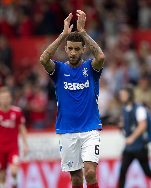 Rangers Connor Goldson Celebrates Premiership Victory at Pittodrie Stadium: Salute to the Fans