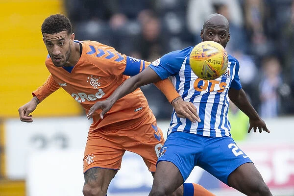 Rangers Connor Goldson vs. Kilmarnock's Youssouf Mulumbu: Intense Face-Off in Scottish Premiership Clash at Rugby Park