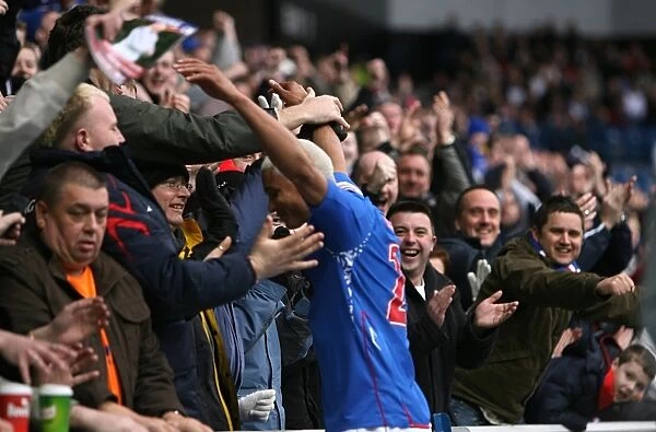 Rangers Daniel Cousin Celebrates Glory with Ecstatic Fans: 4-2 Clydesdale Bank Premier League Victory