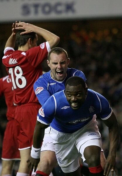 Rangers Darcheville and Boyd: Celebrating a 2-0 Goal Against Aberdeen in the Clydesdale Bank Premier League