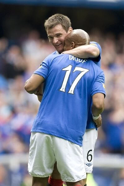 Rangers Diouf and McCulloch: Jubilant Celebration of Their 4-0 Goals Against Hearts at Ibrox