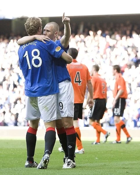 Rangers Double Trouble: Miller and Jelavic Celebrate Four-Goal Lead Over Dundee United at Ibrox