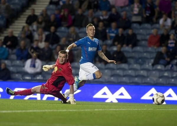 Rangers Take Early Lead: Barrie McKay Scores Stunner at Ibrox (2-0)