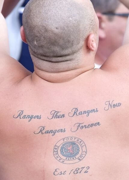 Rangers Fans Unwavering Passion: A Tattooed Back Amidst Sheffield Wednesday's 1-0 Lead