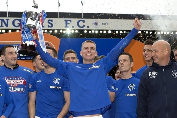 Rangers FC Celebrate Irn-Bru Scottish Third Division Title: Andy Mitchell Lifts the Trophy at Ibrox Stadium