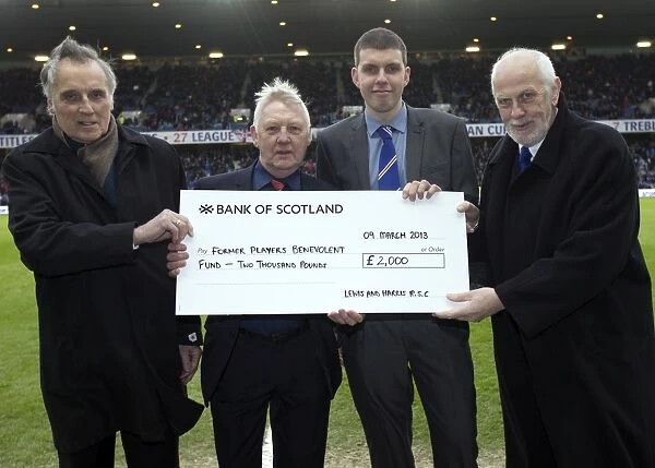 Rangers FC vs Annan Athletic: An Unforgettable Moment of Generosity Amidst Defeat - Rangers Fans from Stornaway RSC Present Colin Jackson with a Cheque