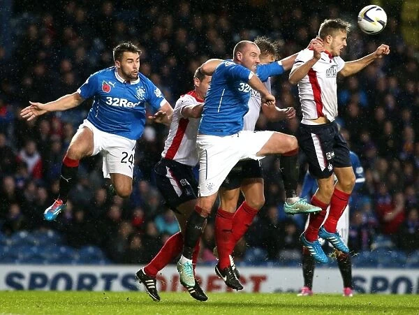 Rangers FC vs Falkirk: Kirs Boyd's Determined Battle for the Ball - Scottish Championship Scottish Cup Winning Moment