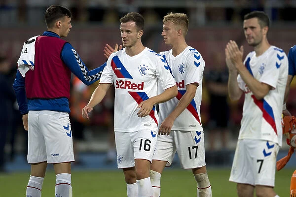 Rangers Football Club: Andy Halliday, Ross McCrorie, and Jamie Murphy Celebrate Europa League Victory Over FC Shkupi with Fans