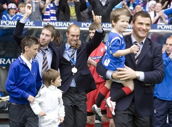 Rangers Football Club: Euphoric Celebration of SPL Championship Win by Kirk Broadfoot and Steven Whittaker at Ibrox Stadium (2010-11)