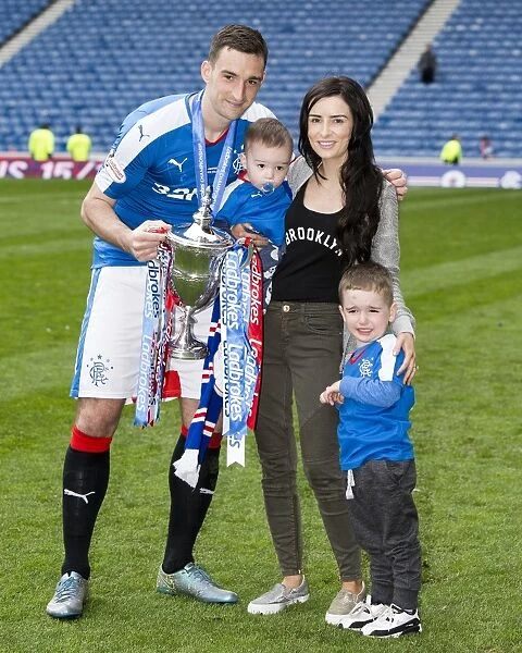 Rangers Football Club: Lee Wallace and Family Celebrate Championship Victory with the Trophy at Ibrox Stadium