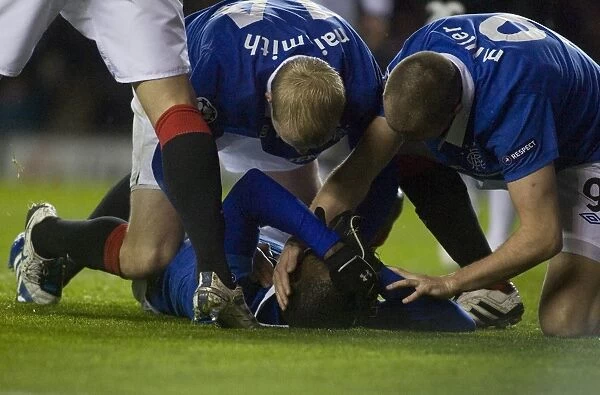 Rangers Football Club: Maurice Edu's Injured Goal Celebration with Naismith and Miller (1-1) vs Valencia, UEFA Champions League - Group C, Ibrox