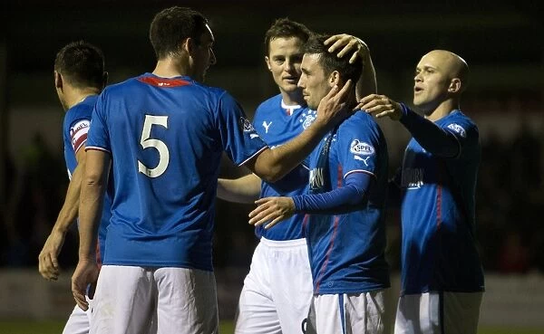 Rangers Football Club: Nicky Clark's Thrilling Goal Celebration with Team Mates in Scottish League One (2003 Scottish Cup Winning Squad)