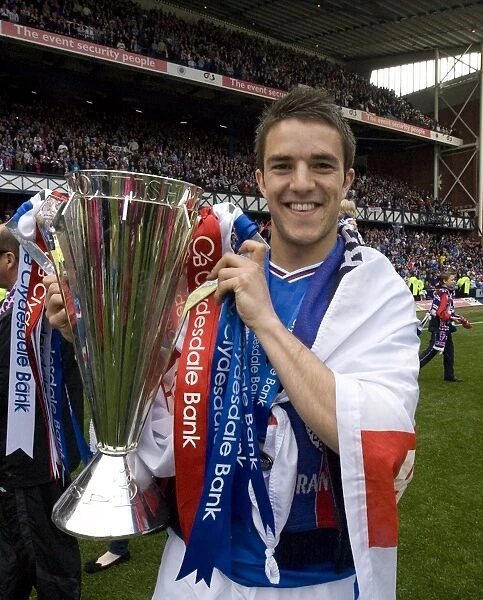 Rangers Football Club: SPL Champions - Andrew Little Celebrates Victory with the Trophy at Ibrox Stadium