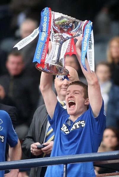 Rangers Football Club: Steven Davis Lifts the Co-operative Cup Trophy (Champions 2011) after Celtic Victory
