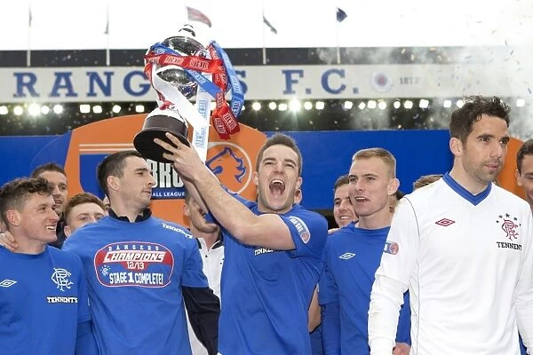 Rangers Football Club: Triumphant Third Division Victory - Andy Little Lifts the Irn Bru Trophy at Ibrox Stadium