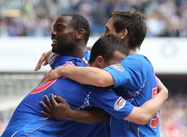 Rangers Glory: Darcheville, Ferguson, and Furman's Jubilant Reaction to Scoring the Third Goal vs. Dundee United (3-1)