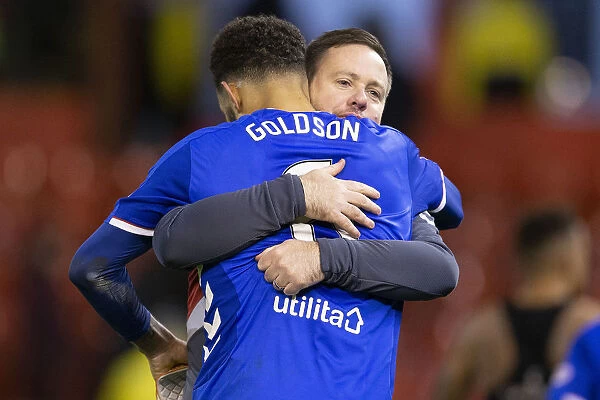 Rangers Goldson and Beale Celebrate Scottish Premiership Victory at Pittodrie Stadium