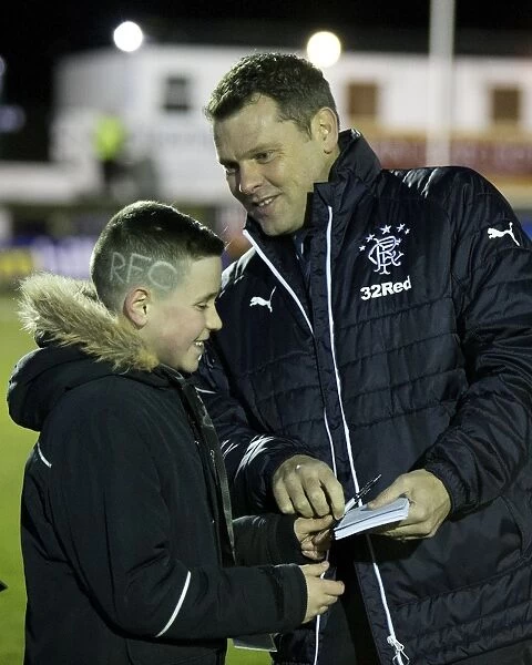 Rangers Graeme Murty Inspects Unique Fan Haircut at Fraserburgh's Bellslea Park during Scottish Cup Match (2003)