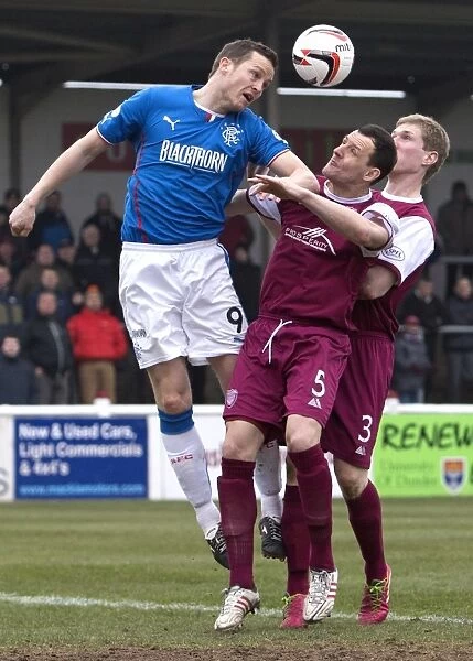 Rangers Jon Daly Soars Over Defenders in Scottish League One Clash vs Arbroath