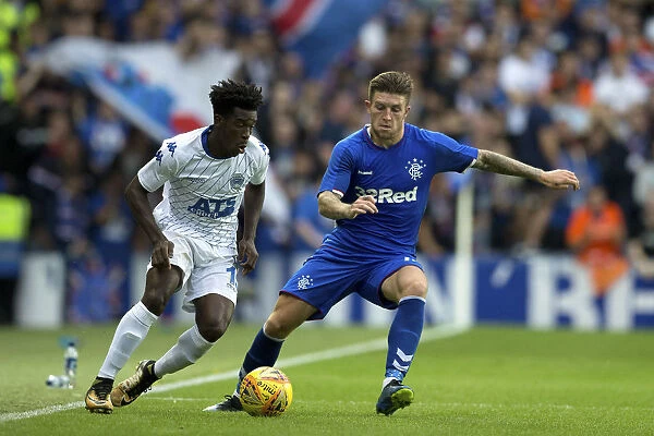 Rangers Josh Windass in Pursuit: Chasing Down the Ball in Europa League Action at Ibrox Stadium