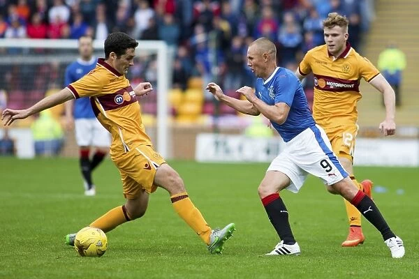 Rangers Kenny Miller Evades Carl McHugh: Intense Moment from Betfred Cup Clash at Fir Park