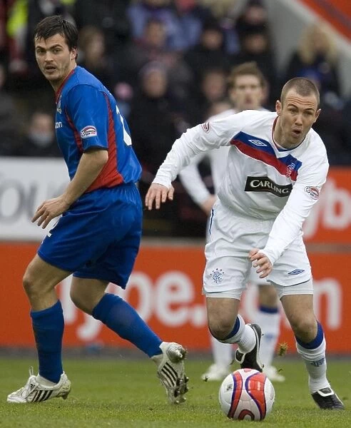 Rangers Kenny Miller Evades Inverness Russell Duncan: 3-0 Clydesdale Bank Scottish Premier League Victory