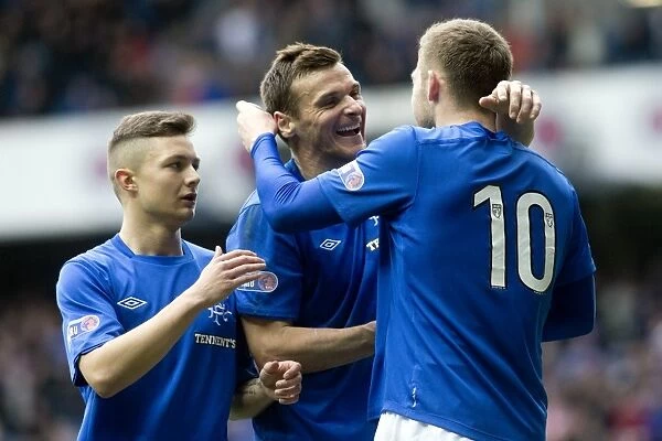 Rangers Kyle Hutton and Teammates: Double Delight - Celebrating Goals 1 and 2 in a Dominant 2-0 Win Over Clyde at Ibrox Stadium