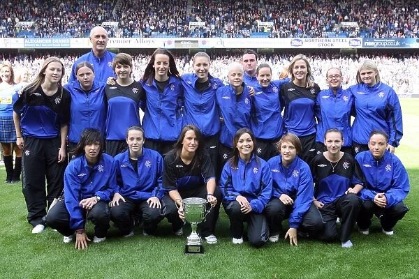 Rangers Ladies Celebrate First Division Title Win: Triumphant Moment with the Trophy at Ibrox Stadium
