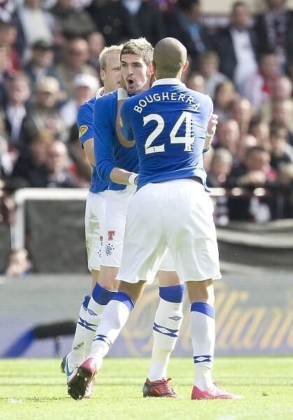 Rangers Lafferty and Bougherra: Unstoppable Duo Celebrates Goal in Heart of Midlothian Clash (2-1 Rangers)
