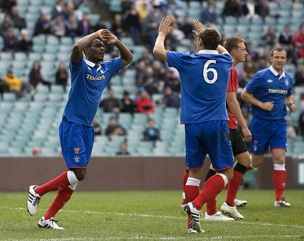 Rangers Maurice Edu and Lee McCulloch Celebrate Goal Against Blackburn Rovers at Sydney Football Stadium (Sydney Festival of Football 2010)