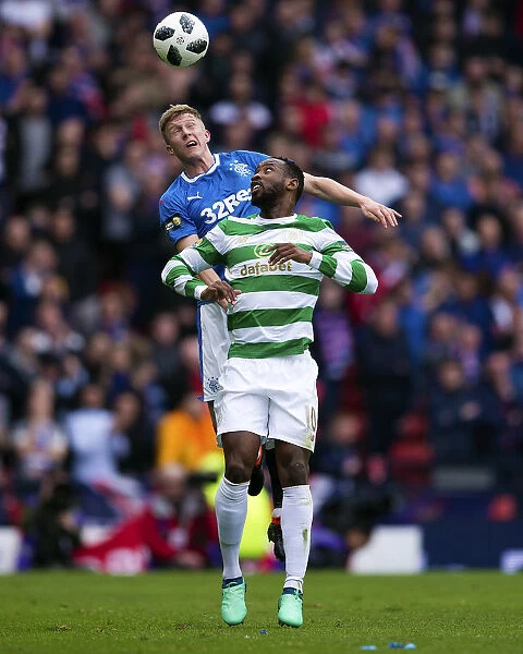 Rangers McCrorie Clears Threat: A Tense Moment as McCrorie Heads Away Dembele's Attack in the Scottish Cup Semi-Final Showdown at Hampden Park